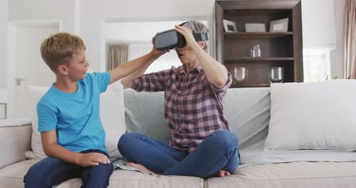 Grandmother and Child Playing Virtual Reality Game