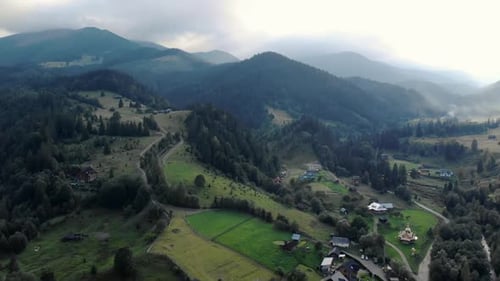 Picturesque Aerial View of the Mountain Landscape Forests Meadows and Small Villages