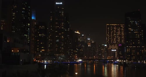 Beautiful View on Dubai Marina and Lights From Skyscrapers Reflecting on Water