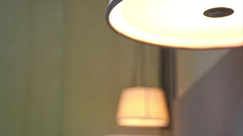 Cozy Bedroom Interior with Bed and Hanging Lamp