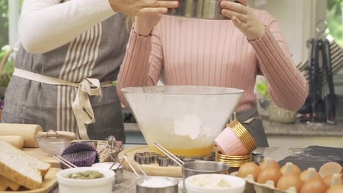 Portrait of western mother and daughter cooking and baking breakfast, Food bread