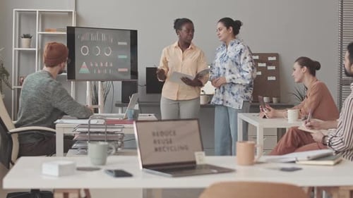 Creative Marketing Team Discussing Project in Office