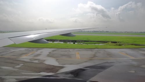 the Plane on the Takeoff Strip Is Preparing for Takeoff. View From the Window on the Wing of the