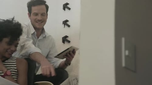 Team Meeting on Stairs With Tablet