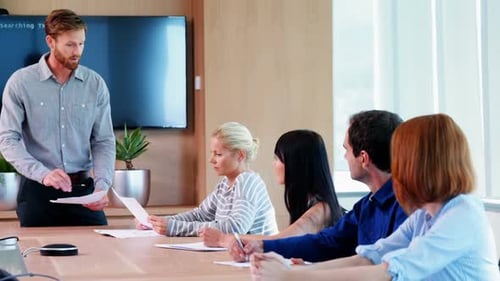 Business Team in Meeting Discussing Data