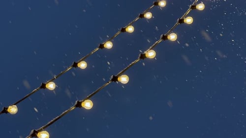Festive Lights and Snow at Night