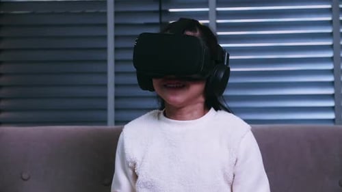 Girl Enjoys Virtual Reality Gaming at Home
