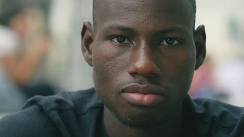 Young Man Smiling In Close Up Portrait