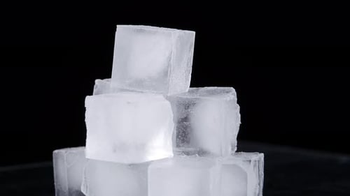 Melting Ice Cubes on Black Background