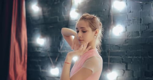 Graceful Dancer Warming Up Before Performance