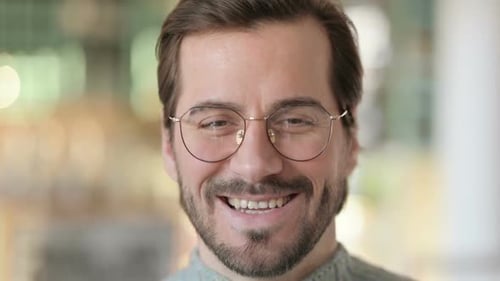 Close Up of Smiling Man Wearing Glasses