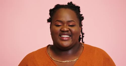 Smiling Woman Close Up on Pink Background