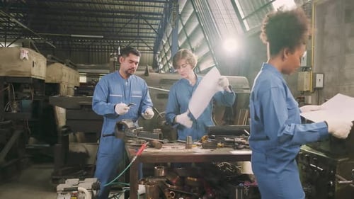 Professional workers teams work in the metalwork manufacturing factory.