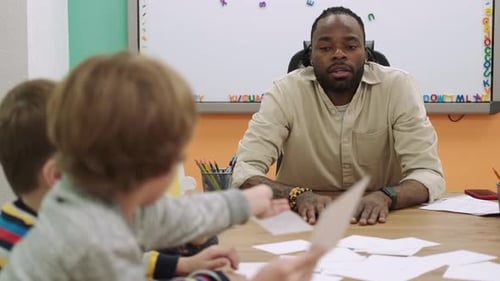 Teacher with Students in Elementary School Classroom