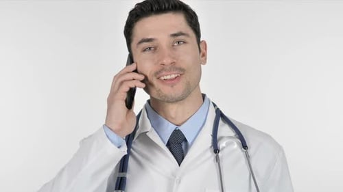 Young Doctor Talking on Cell Phone Smiling
