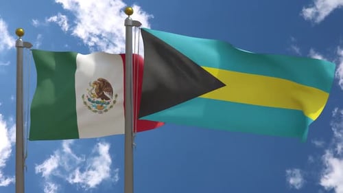 Mexico and Bahamas National Flags Waving Against Blue Sky