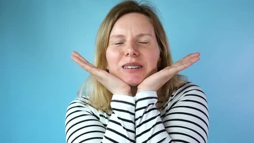 Smiling Woman with Braces Poses for Camera