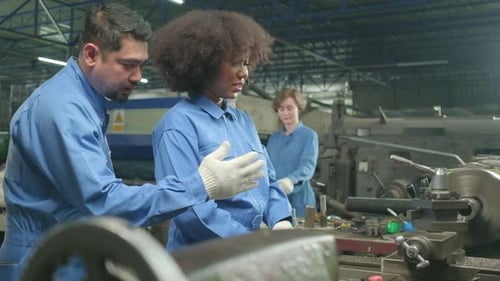 Professional workers teams work in the metalwork manufacturing factory.