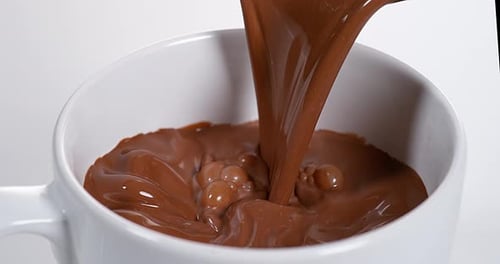 Chocolate Pouring into a Bowl, Slow Motion 4K