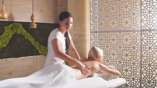 Blonde Girl Resting in Massage Center