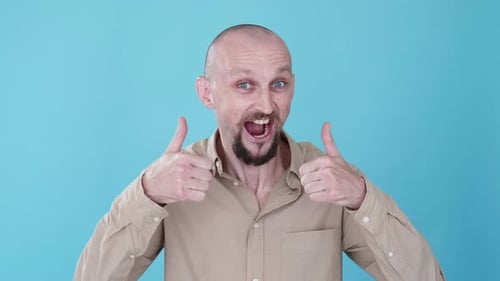 Man Gives Thumbs Up on Blue Background