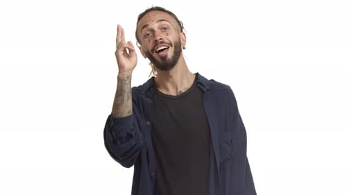 Man Points at Camera With Index Finger Up