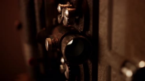 Antique Film Projector Showing the Lens and Film Reel