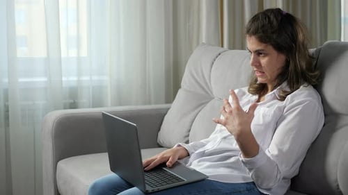 Disabled Woman Talks at Job Interview Via Skype on Laptop