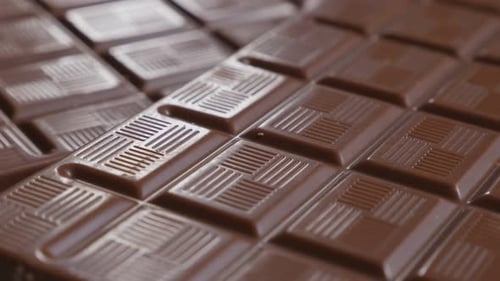 Chocolate dark block details slow close-up tilting 4K 2160p 30fps UltraHD video - Perspective made