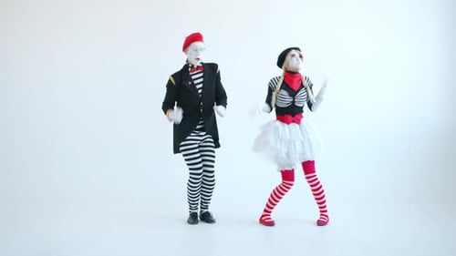 Two Mimes Dancing, Performing on White Background