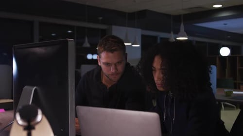 Young office executives working over computer in a modern office