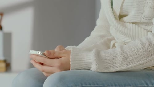 Girl Typing Message on Smartphone, Chatting Online, Close-Up of Woman's Hand