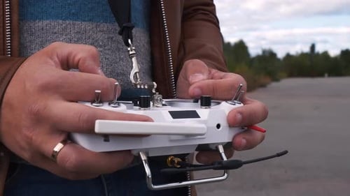 FPV Drone Racer Holding Remote Control Close Up