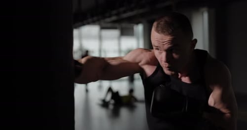 Boxer Hitting a Punching Bag Slow Motion at 120 Fps in
