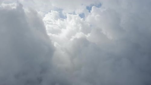 Aerial View of Fluffy Clouds Moving in Sky