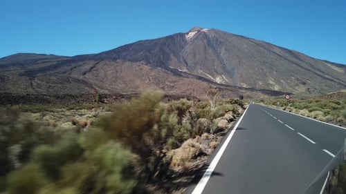 Empty road in mountains on sunny day