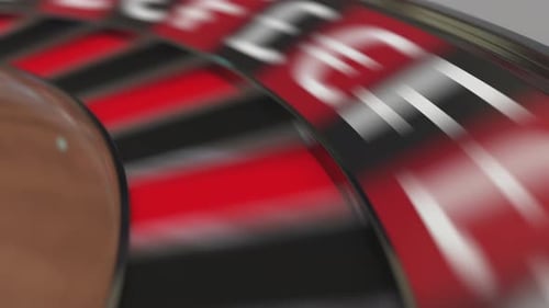 Ball in Dollar Sign Pocket on Casino Roulette Wheel