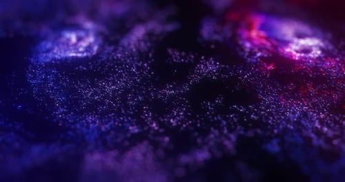 abstrakte Bewegung von neonvioletten und roten Partikeln mit Bokeh.