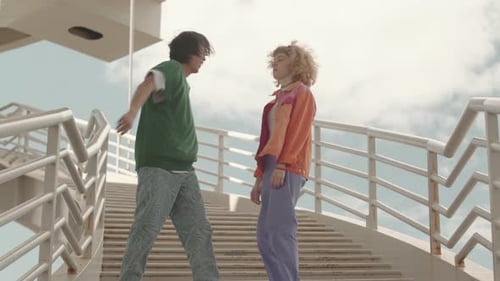 Young Couple Dancing on Urban Overpass