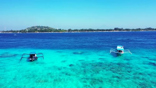 Wide birds eye tourism shot of a white paradise beach and turquoise sea background in best quality