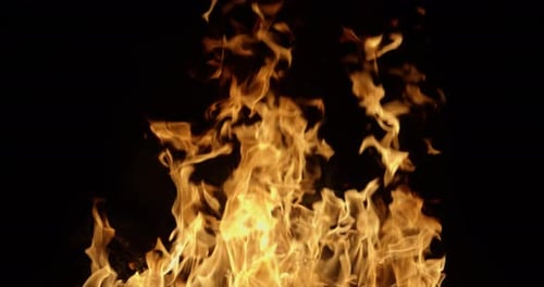 A Blazing Fire At Night On A Black Background