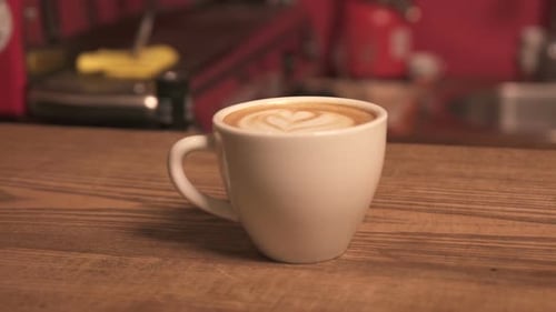Latte Art in a White Mug in a Cafe