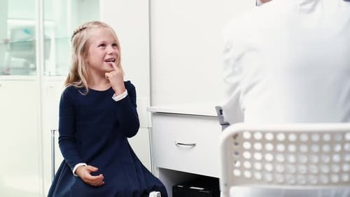 Girl Talking to Doctor During Medical Exam