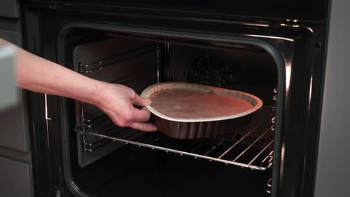 Cake Batter Placed into Oven for Baking