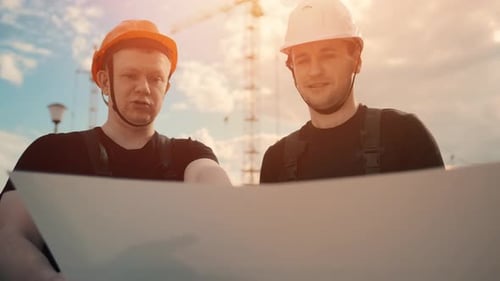 An Builders Are Studying Construction Plan and Analyze Are Building Construction.