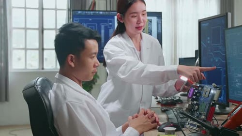 Asian Team Of Multi Engineers, Scientists Work On Tablet And Computer, Talk, Design Pcb