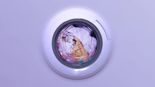 Weiße Waschmaschine wäscht Kleidung