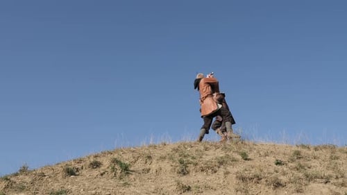 Brave medieval men fighting on a hill