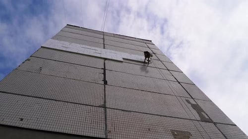 Industrial Climber Insulation of Facade Old High-Rise Building Using Styrofoam