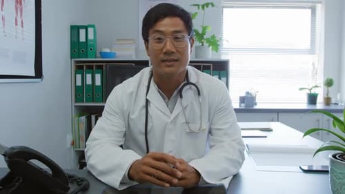 Doctor Talking to the Camera in His Office